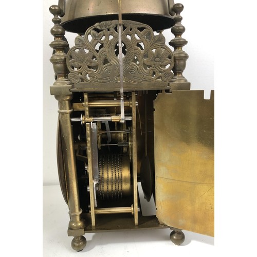 853 - A 17th century style lantern clock, with a single fusee movement striking on a bell, in a brass case... 