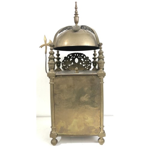 853 - A 17th century style lantern clock, with a single fusee movement striking on a bell, in a brass case... 