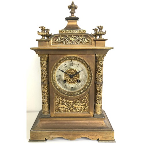 854 - A mantel clock, with an eight day movement, striking on a chime, in a gilt metal case, 40 cm high, a... 