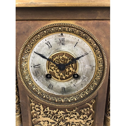 854 - A mantel clock, with an eight day movement, striking on a chime, in a gilt metal case, 40 cm high, a... 