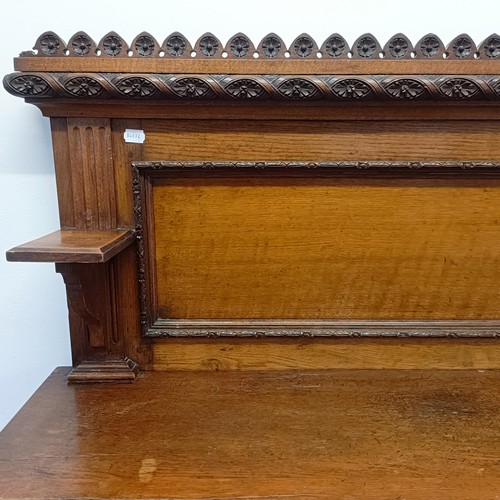 910 - A Victorian oak buffet, with a raised back, on a base with two drawers and two cupboard doors, 153 c... 