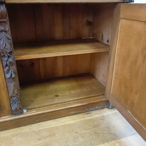 910 - A Victorian oak buffet, with a raised back, on a base with two drawers and two cupboard doors, 153 c... 