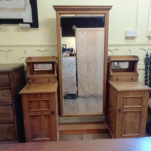 915 - A 19th century satin birch cheval mirror, flanked by two cupboards, 160 cm wide