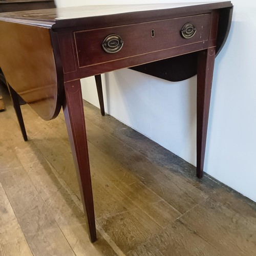 917 - A 19th century mahogany Pembroke table, on tapering square legs, 102 cm wide