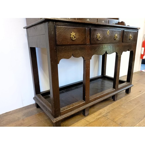 923 - A 19th century oak dresser, on legs joined by a potboard base, 117 cm wide