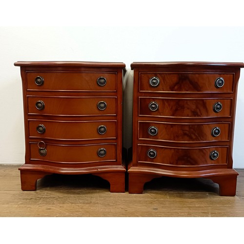 928 - A pair of modern mahogany serpentine front bedside chests, having four drawers, 43 cm wide