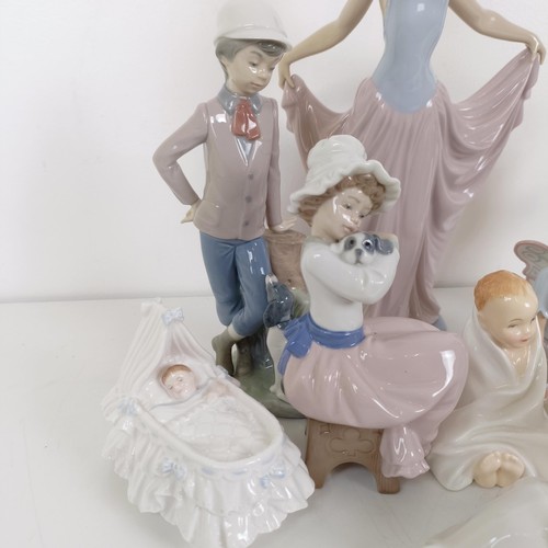 593 - A Lladro figure of a woman, 32 cm high, assorted other Lladro and Lladro style figures (13)