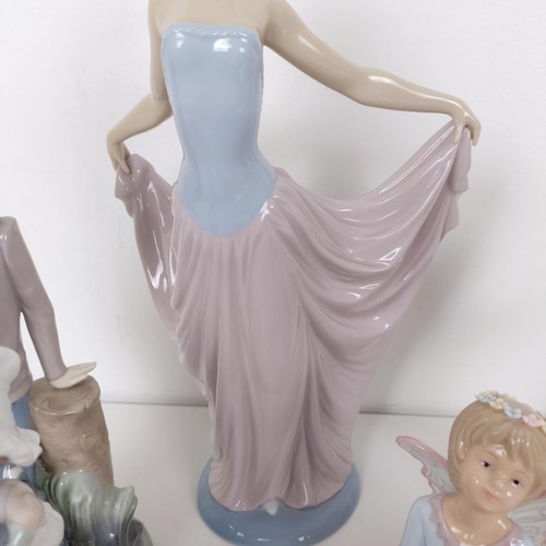 593 - A Lladro figure of a woman, 32 cm high, assorted other Lladro and Lladro style figures (13)