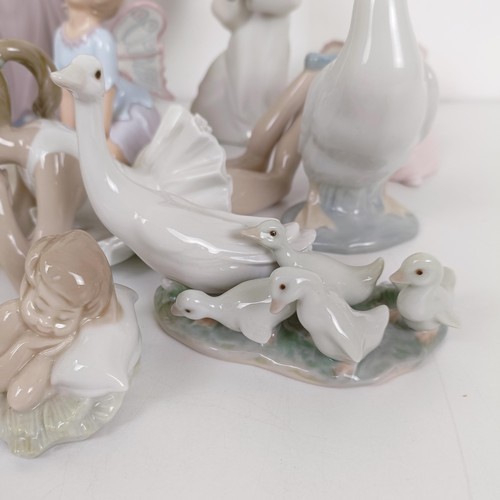 593 - A Lladro figure of a woman, 32 cm high, assorted other Lladro and Lladro style figures (13)