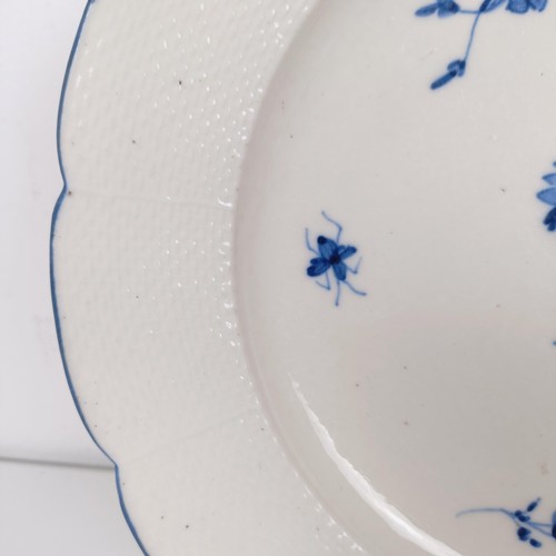 590 - An early 19th century blue and white plate, decorated flowers and insects