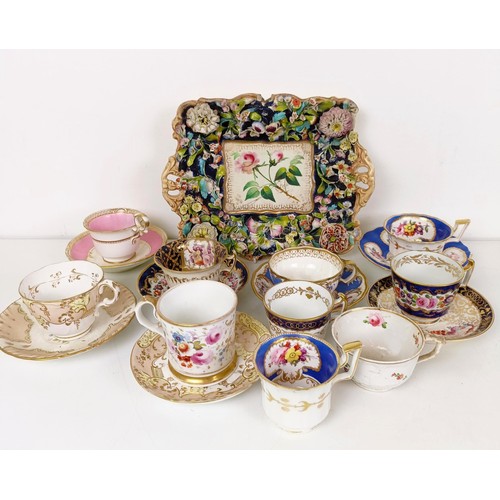 588 - A cabinet cup and saucer, assorted other cups and saucers, and a floral encrusted twin handle bowl (... 