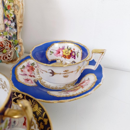 588 - A cabinet cup and saucer, assorted other cups and saucers, and a floral encrusted twin handle bowl (... 