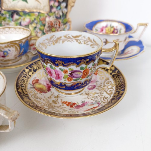 588 - A cabinet cup and saucer, assorted other cups and saucers, and a floral encrusted twin handle bowl (... 