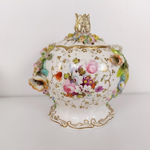 586 - A 19th century floral encrusted vase and cover, 21 cm high, various losses, and three mugs (4)