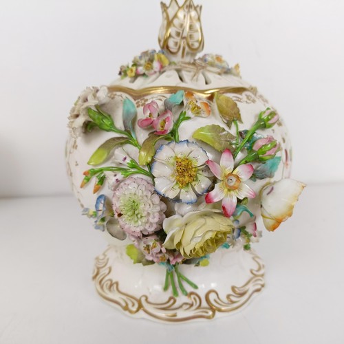 586 - A 19th century floral encrusted vase and cover, 21 cm high, various losses, and three mugs (4)