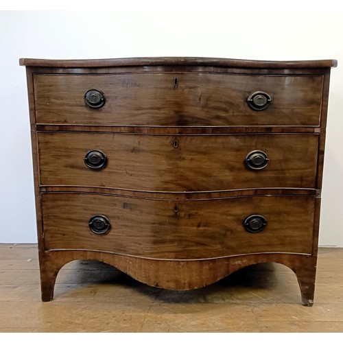 933 - A 19th century mahogany serpentine chest, having three drawers, 118 cm wide