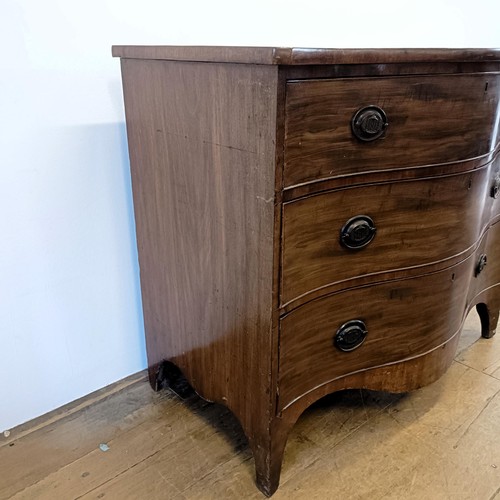 933 - A 19th century mahogany serpentine chest, having three drawers, 118 cm wide