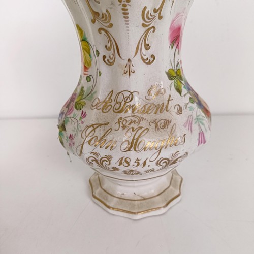 585 - A 19th century jug, decorated flowers, dated 1842, 23 cm high, another, 22 cm high, and another 23 c... 