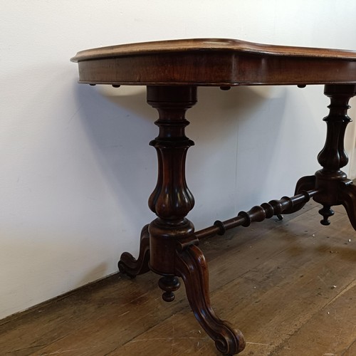 934 - A 19th century walnut serpentine sided table, 122 cm wide