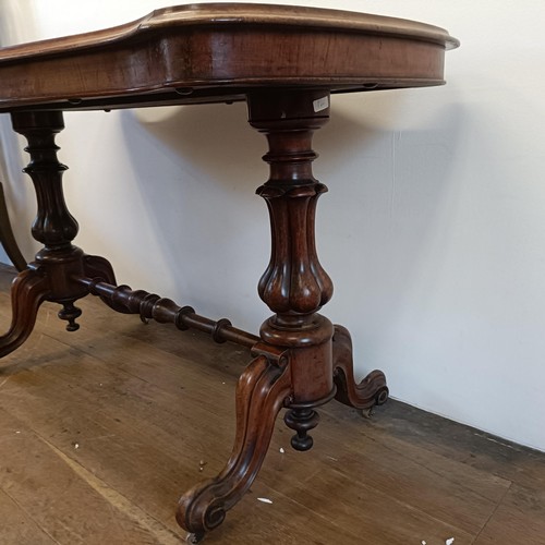 934 - A 19th century walnut serpentine sided table, 122 cm wide