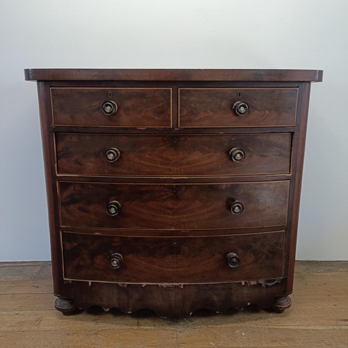 935 - A Victorian mahogany bow front chest, having two short and three long drawers, 126 cm wide