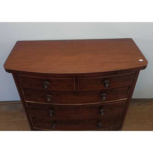 935 - A Victorian mahogany bow front chest, having two short and three long drawers, 126 cm wide