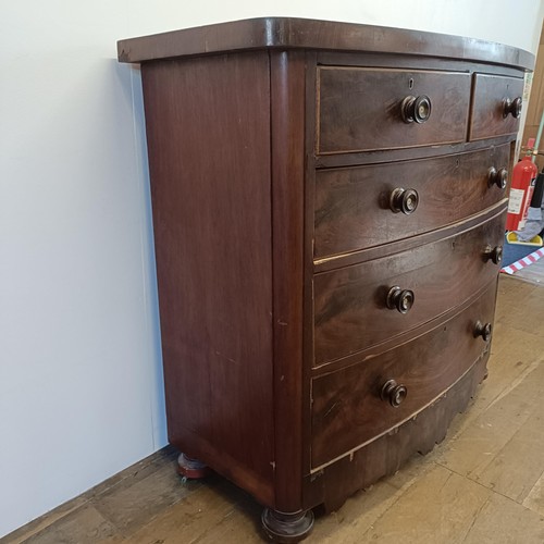 935 - A Victorian mahogany bow front chest, having two short and three long drawers, 126 cm wide