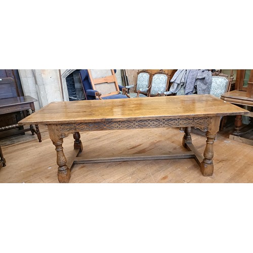 1001 - An 18th century style carved oak refectory dining table, the top 230 x 92 cm