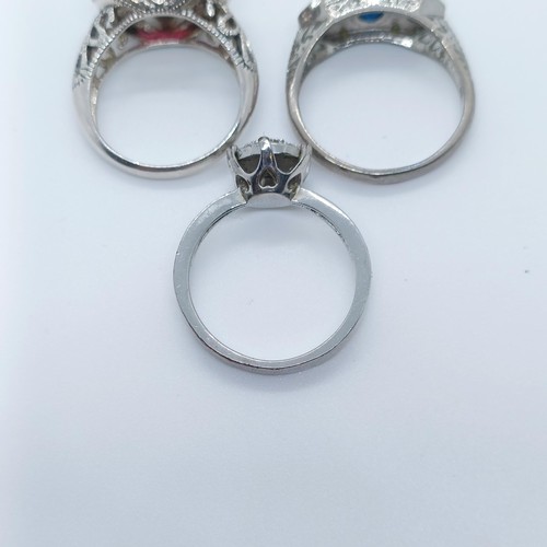 730 - A sterling silver gem set dress ring, and two others (3)