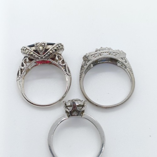 730 - A sterling silver gem set dress ring, and two others (3)