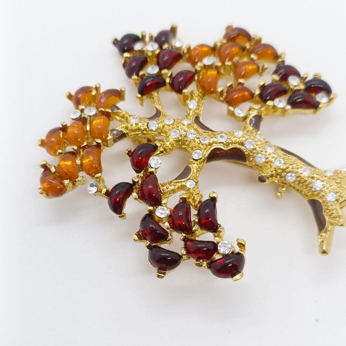 731 - An amber coloured stone brooch, in the form of a tree