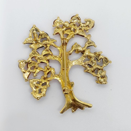 731 - An amber coloured stone brooch, in the form of a tree