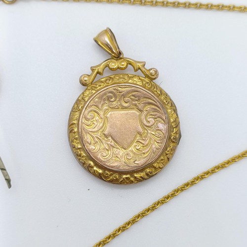 733 - A gilt metal locket, and assorted other jewellery