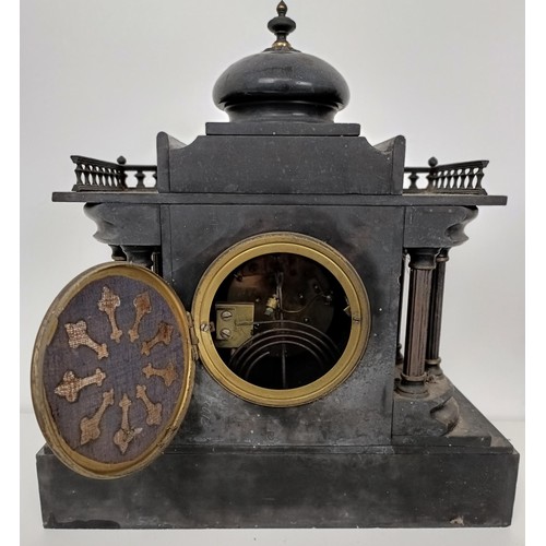 863 - A mantel clock, in a slate case, 27 cm wide, and four other clocks (5)