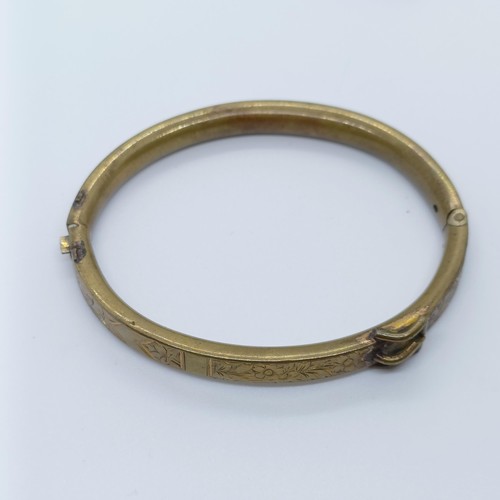 746 - A rolled gold bangle, and assorted other jewellery