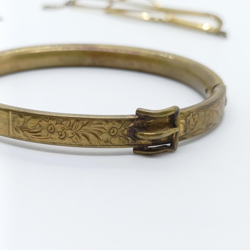 746 - A rolled gold bangle, and assorted other jewellery