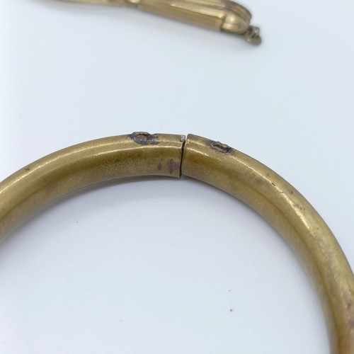 746 - A rolled gold bangle, and assorted other jewellery