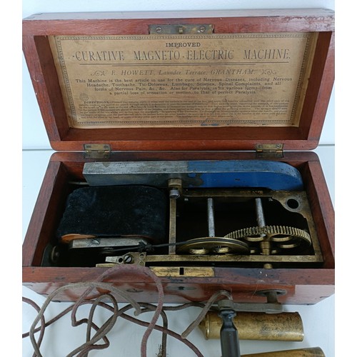 867 - An Improved Curative Magneto Electric Machine, in a mahogany case, 27 cm wide