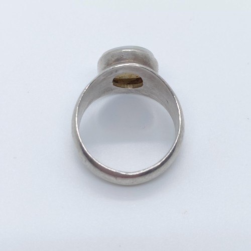 781 - A silver and opal ring, ring size N