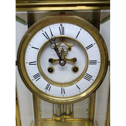 881 - A mantel clock, the enamel dial with a visible anchor escapement, fitted a twin train movement, with... 