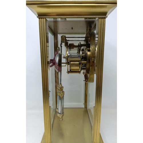 881 - A mantel clock, the enamel dial with a visible anchor escapement, fitted a twin train movement, with... 