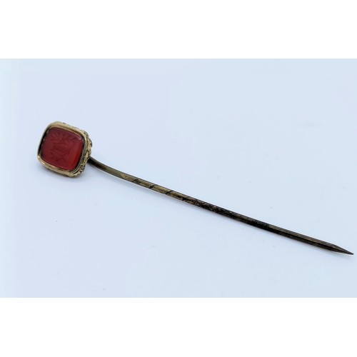 792 - A yellow coloured metal and red stone seal fob, converted to a stick pin