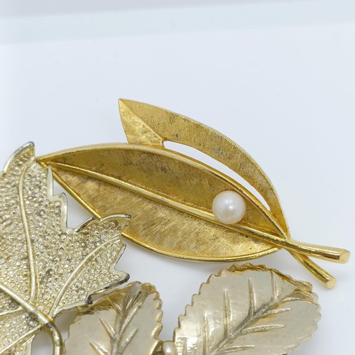 801 - A gilt metal leaf brooch, and four others (5)