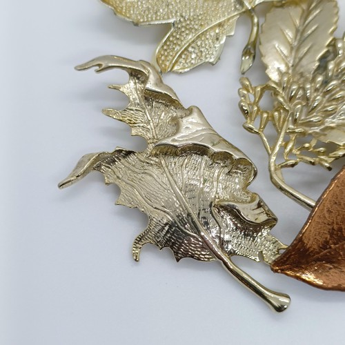 801 - A gilt metal leaf brooch, and four others (5)