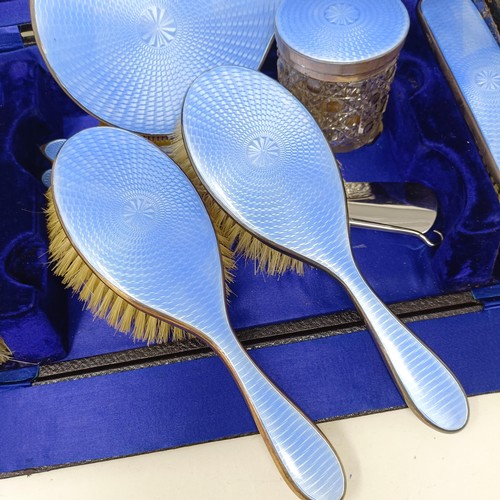 806 - A George V silver and blue enamel dressing table set, comprising a mirror, four brushes, a comb, a s... 