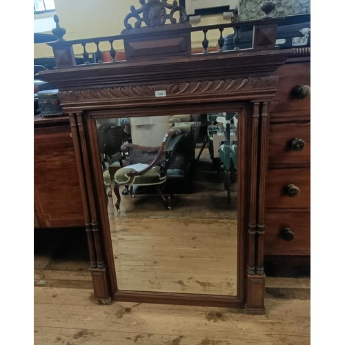 940 - A French wall mirror, in a walnut frame, 132 x 88 cm