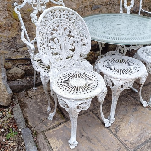 1077 - A painted garden table, 80 cm diameter, two stools, and four garden chairs (8)