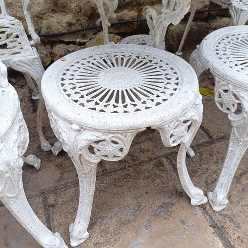 1077 - A painted garden table, 80 cm diameter, two stools, and four garden chairs (8)