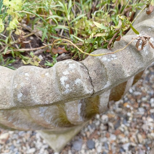 1075 - A pair of composite stone garden urns, 48 cm diameter