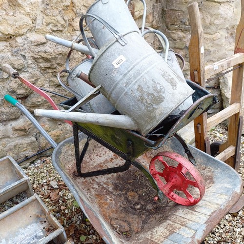 1073 - A painted wheelbarrow, another, assorted watering cans and a sack barrow